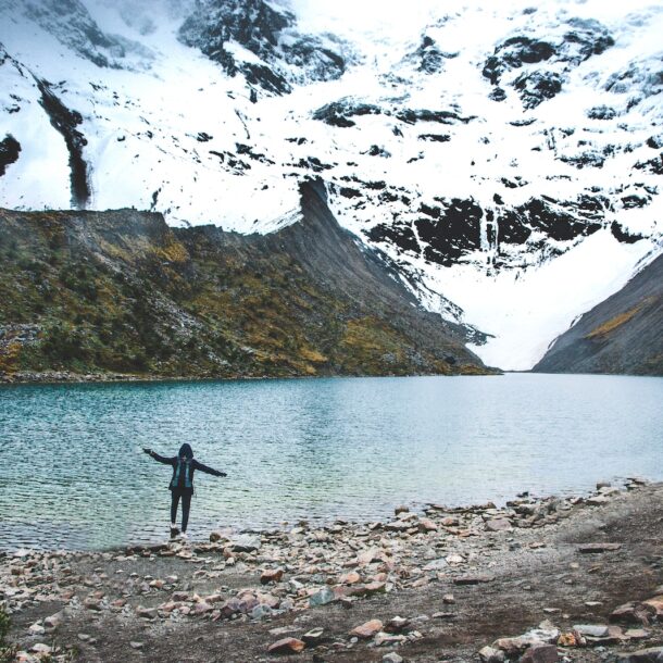 person standing near lake at daytime